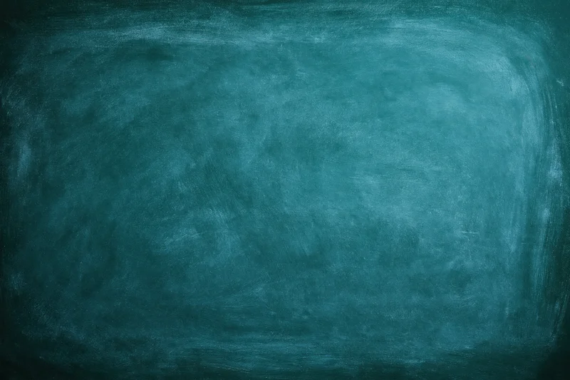 Dark teal chalkboard surface filling the frame with no writing or marks