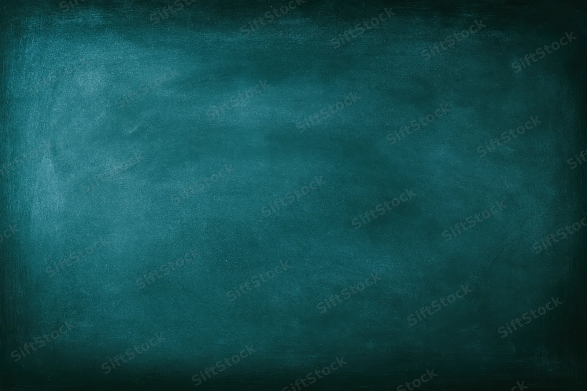 Dark teal chalkboard surface filling the frame with no writing or marks