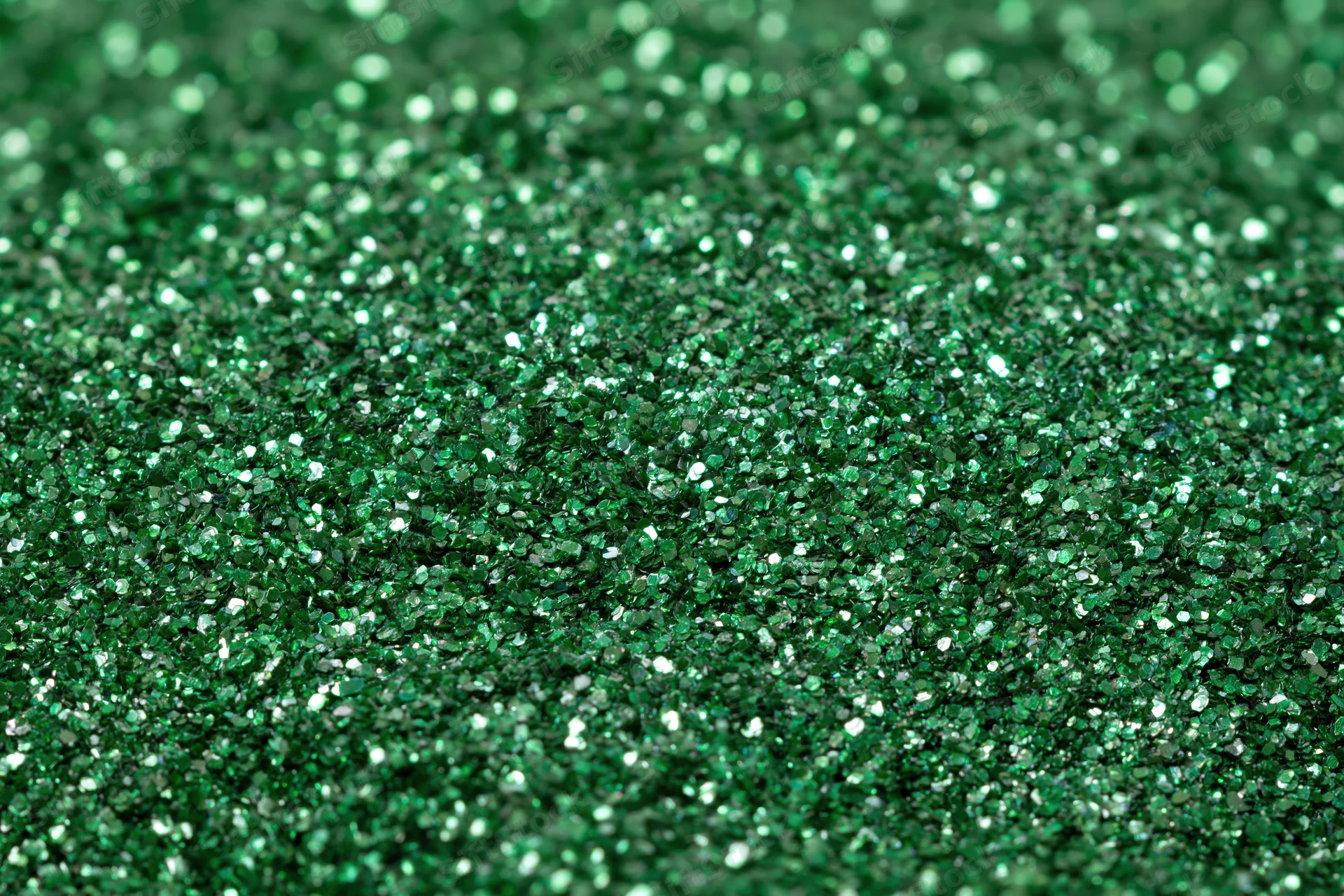 Green glitter surface filling frame in extreme close-up macro view