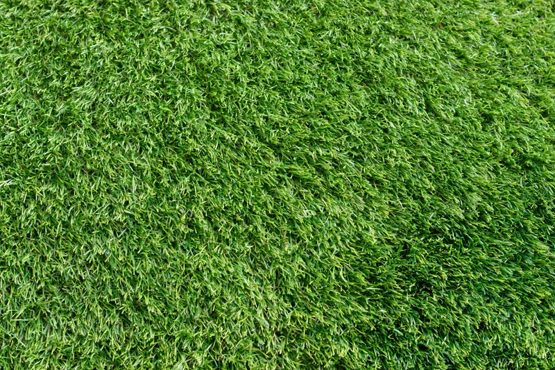 Close-up overhead view of short-cut artificial turf filling the frame