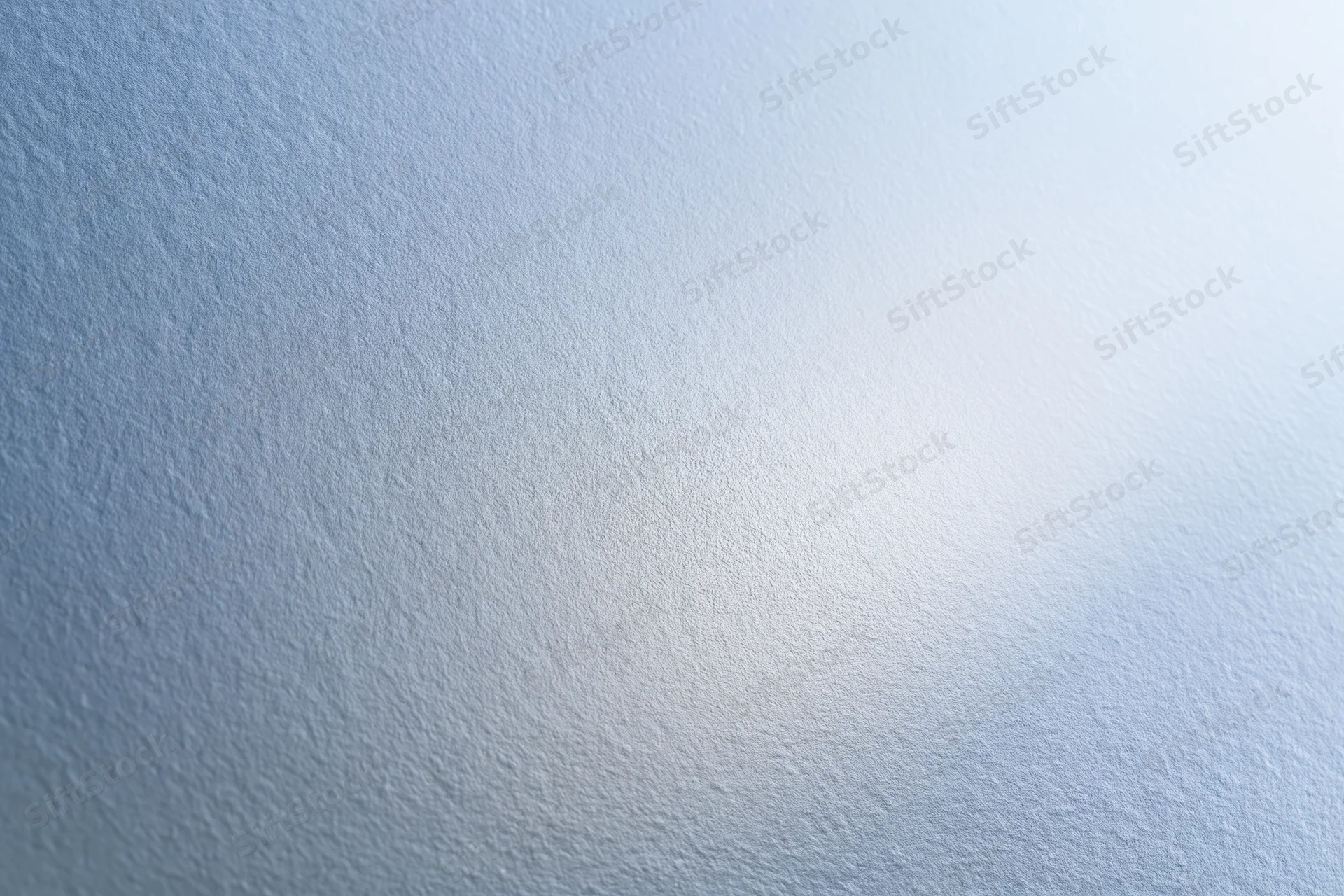 Frosted glass surface filling the frame with soft light gradient and subtle texture