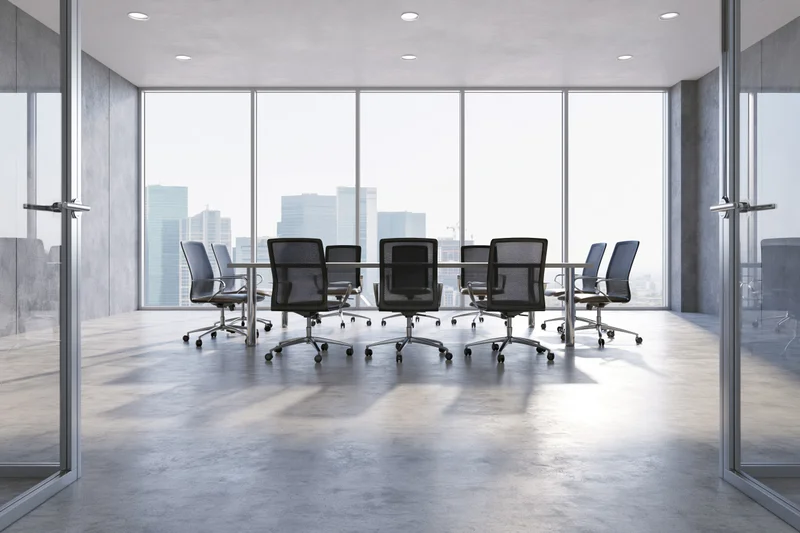 Modern corporate conference room with glass partitions and city view through large windows