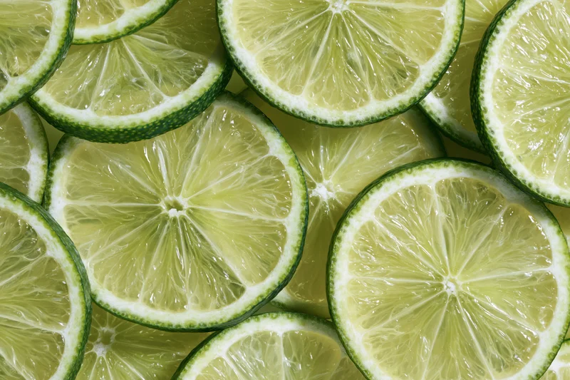 Lime slices arranged in a flat-lay fill-frame pattern