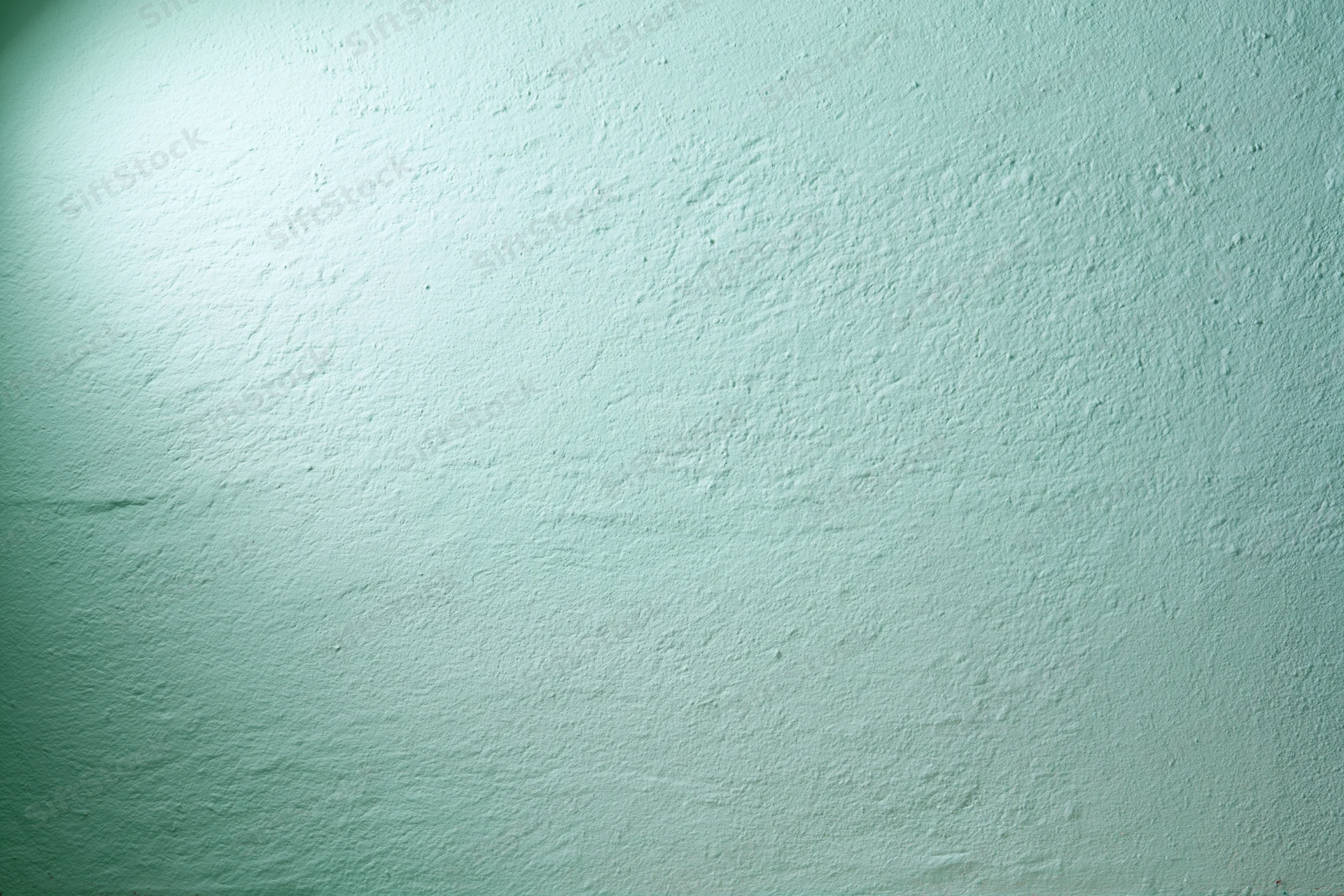 Plain painted wall surface filling the frame with even lighting and subtle texture
