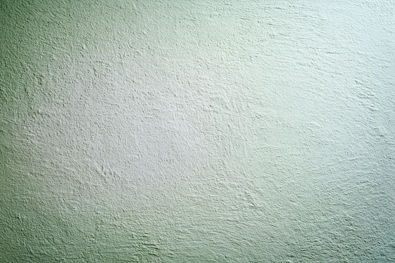 Plain painted wall surface filling the frame in a flat closeup view