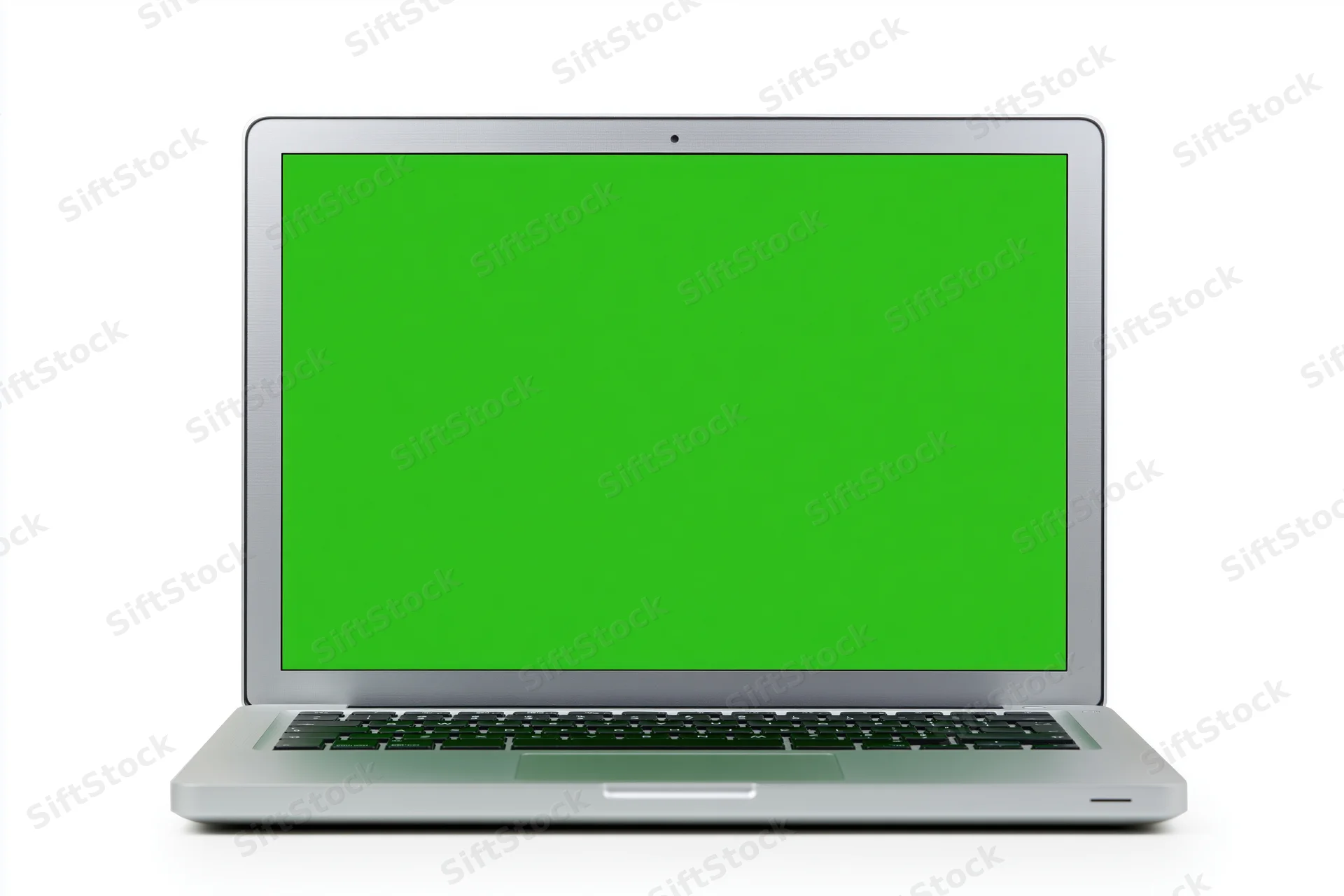 Silver aluminum laptop open face-on displaying a solid bright green screen on white background