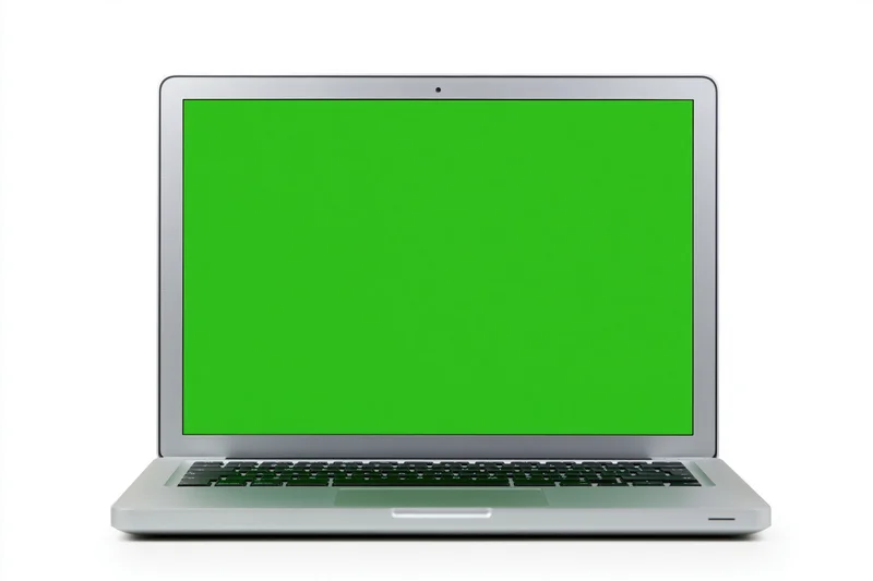 Silver aluminum laptop open face-on displaying a solid bright green screen on white background
