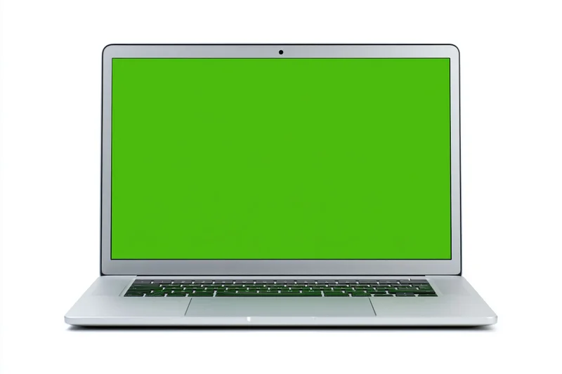 Silver aluminum laptop open face-on with green screen display isolated on white background