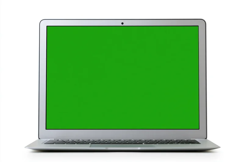 Silver aluminum laptop open face-on with green screen display on white background