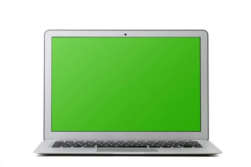 Silver aluminum laptop open face-on with green screen display isolated on white background