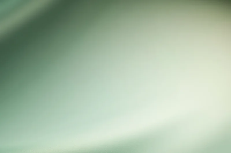 Smooth abstract gradient background with soft blurred transition from green to light cream