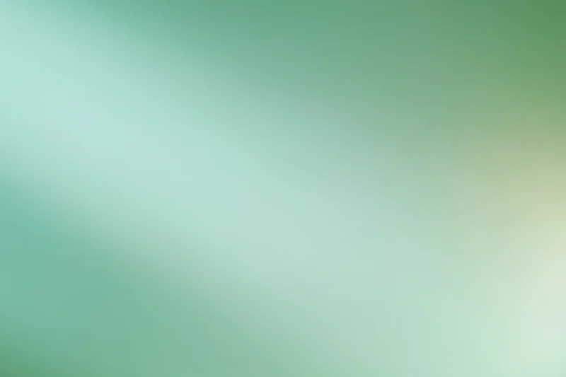 Smooth abstract gradient background with soft blurred transition from green to teal