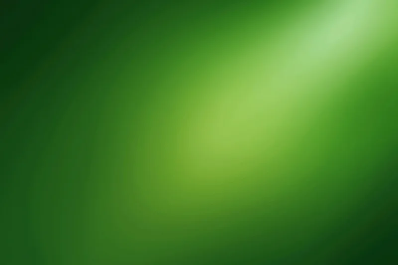 Smooth green gradient background with soft light transition across wide flat surface