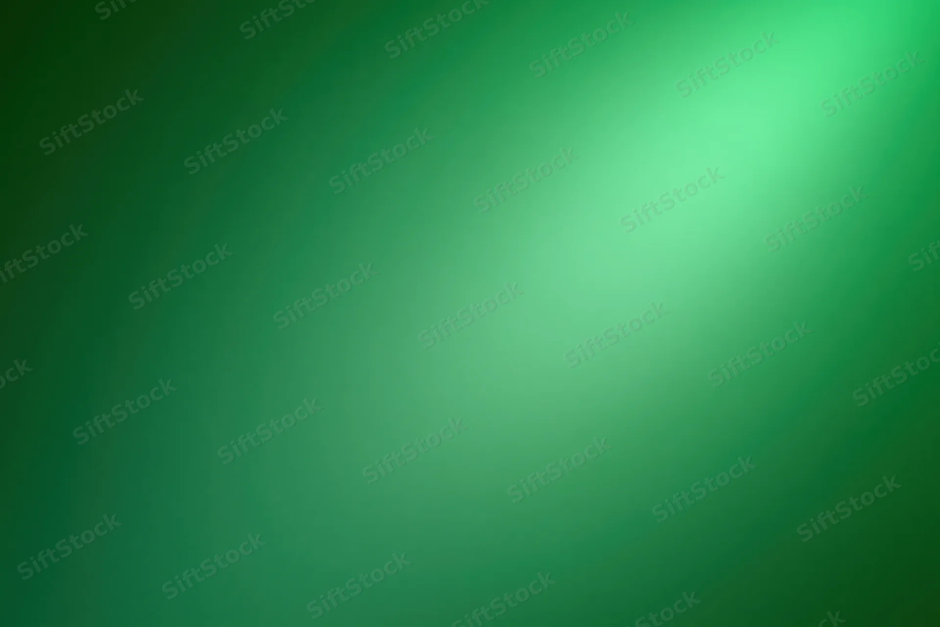 Smooth green gradient background with soft light transition across wide frame