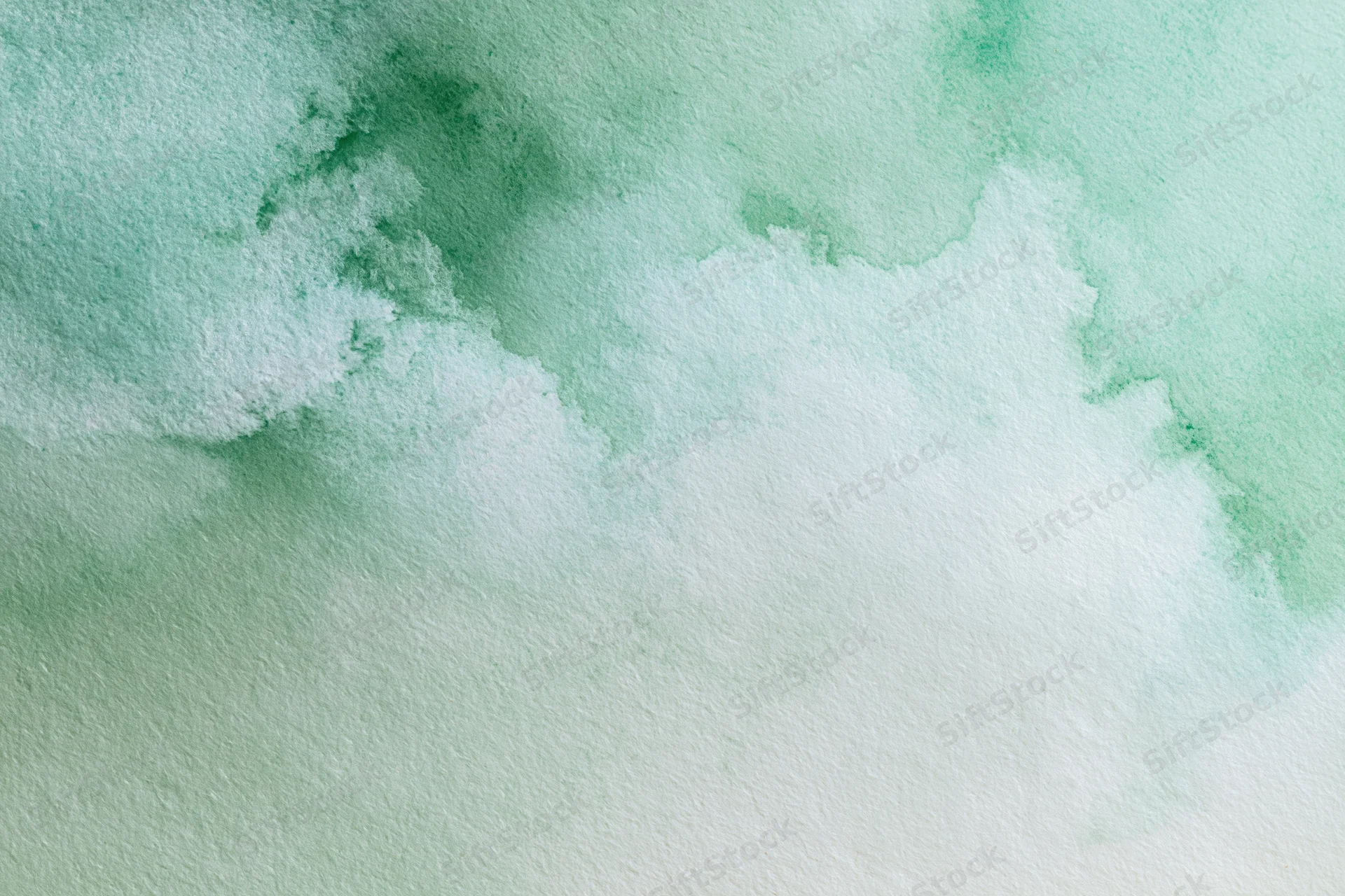 Soft watercolor wash in green and white on textured paper background