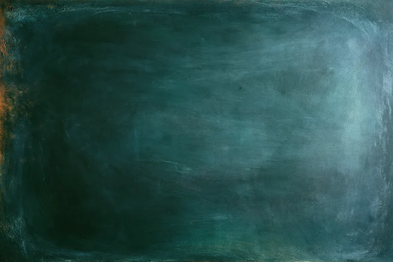 Worn dark green chalkboard surface with smudged texture and visible wear, close-up flat view