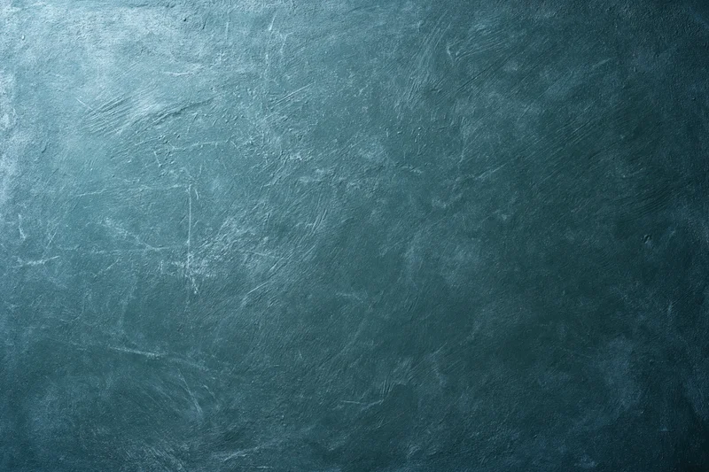 Worn painted concrete wall surface filling the frame