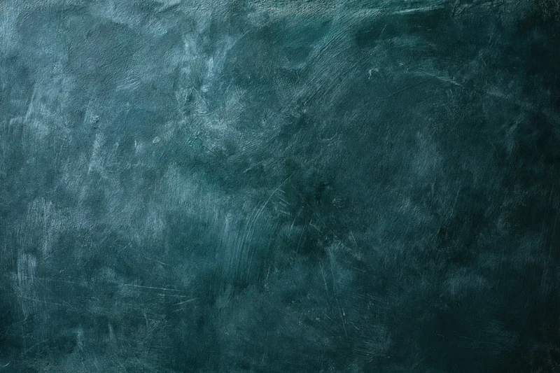 Worn painted concrete wall surface filling the frame