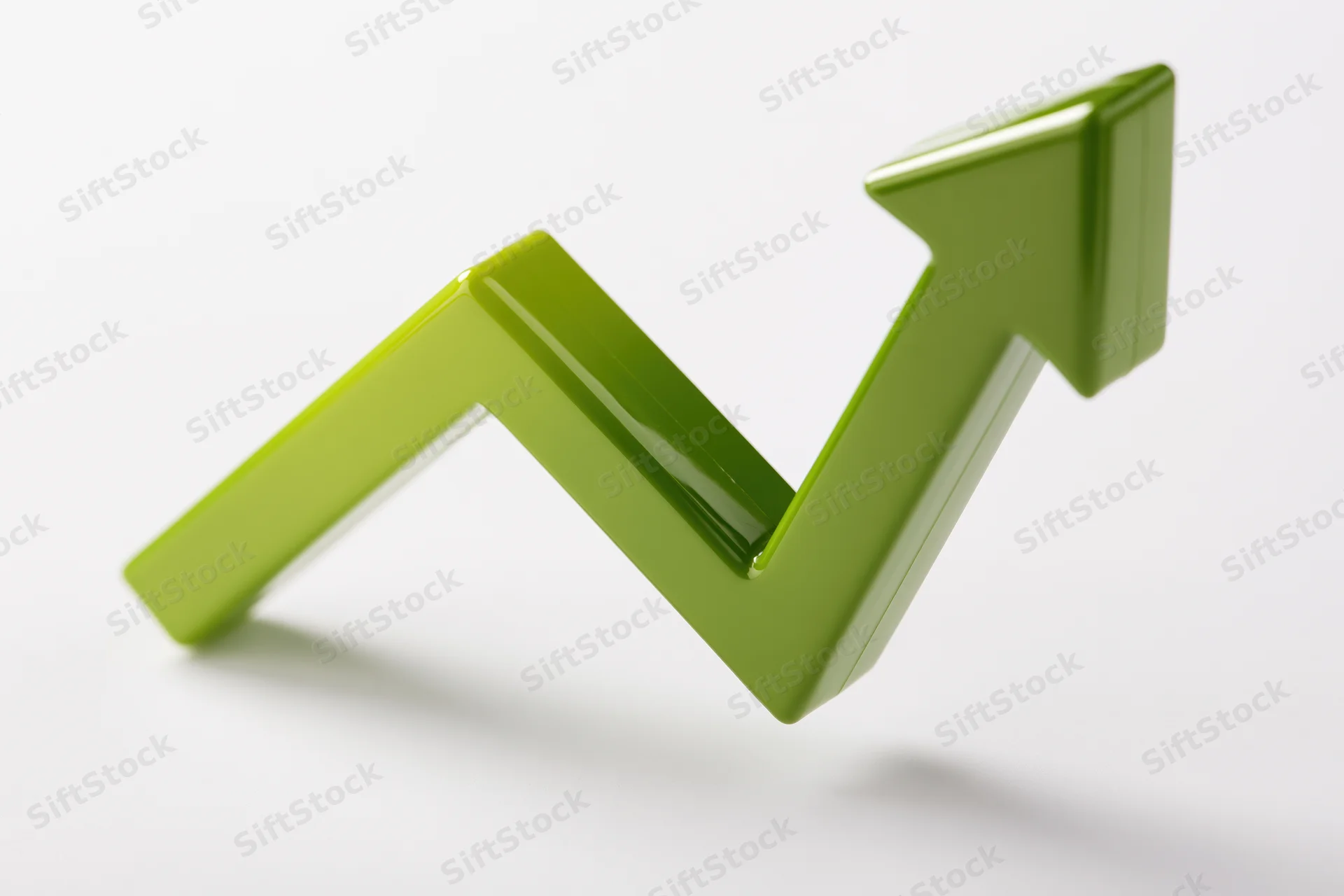 Glossy green 3d arrow pointing upward on white background