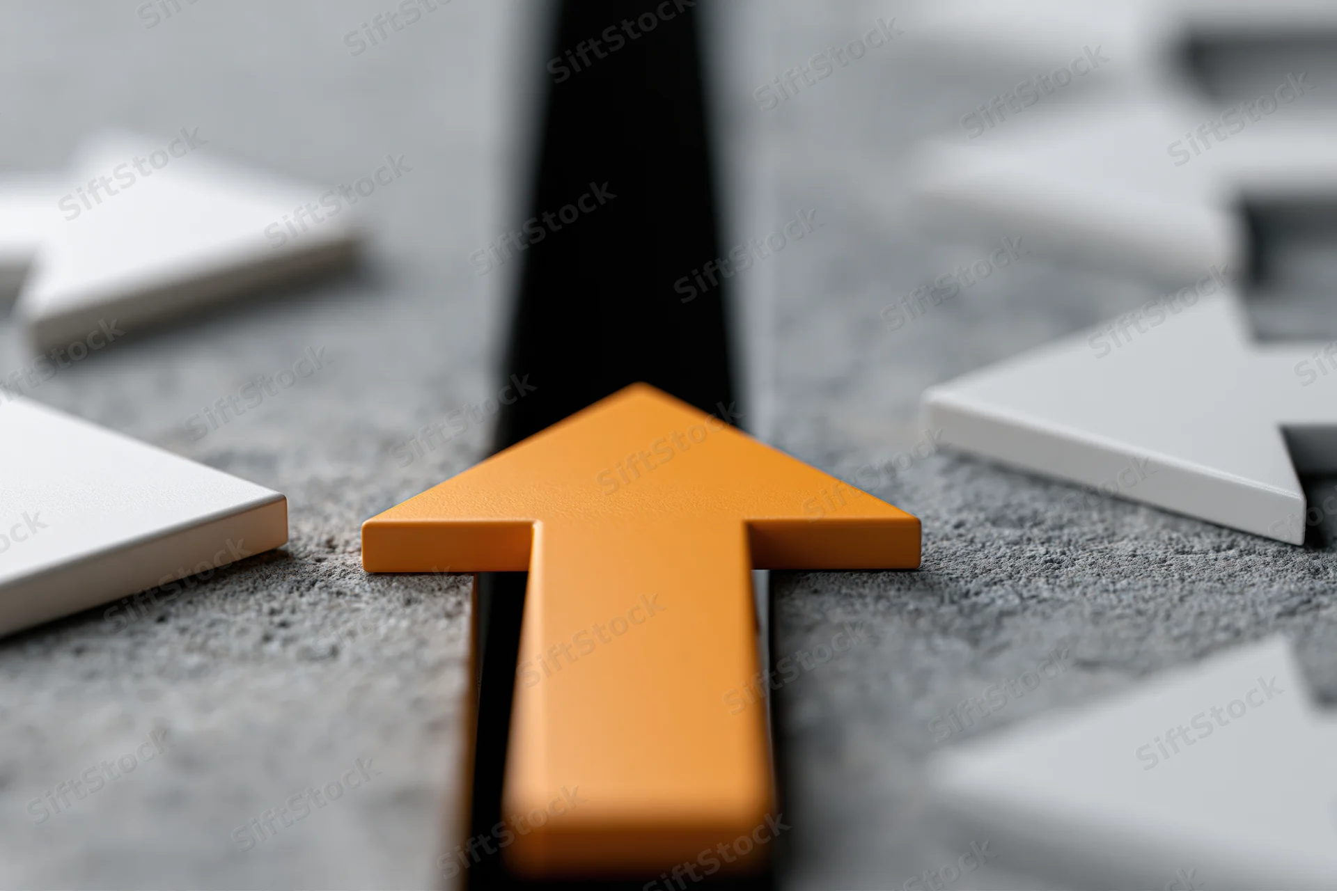 Orange arrow bridging black gap on concrete surface