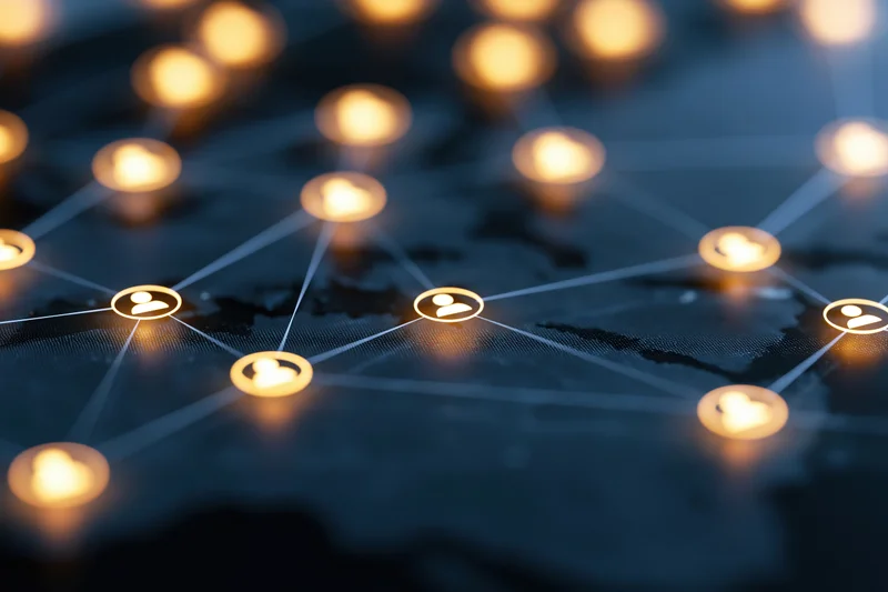 Glowing user profile icons connected by lines over a world map background