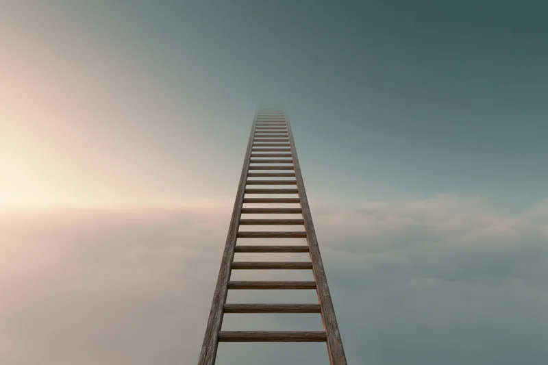 Wooden ladder rising vertically into the sky above a soft cloud layer