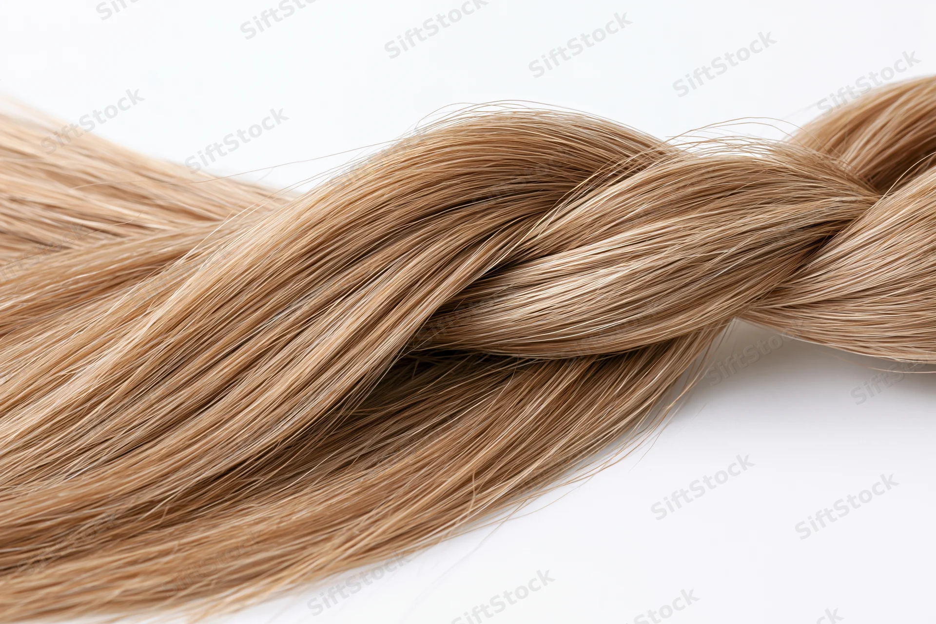 Twisted lock of straight light brown hair forming a loose braid on white background