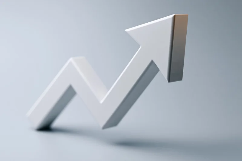 White three-dimensional zigzag arrow pointing upward on a gray background