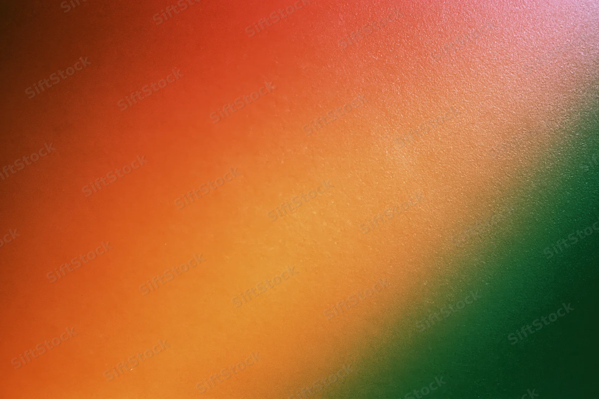Abstract gradient background blending orange and green with grainy texture