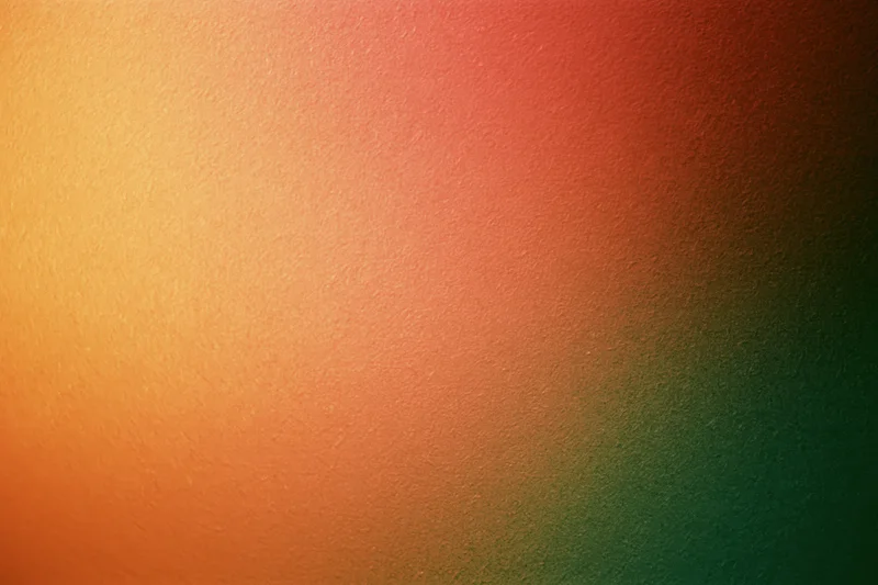 Gradient texture transitioning from orange to red to green across a flat surface