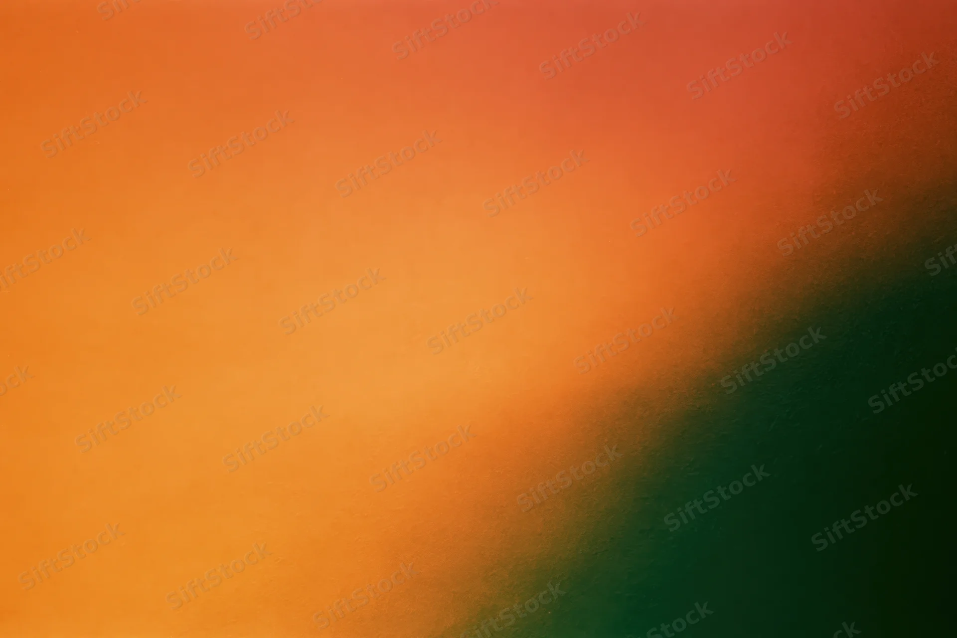 Abstract gradient background blending orange and green with grainy texture