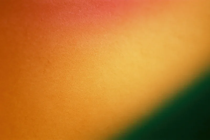 Abstract gradient texture blending orange yellow red and green hues