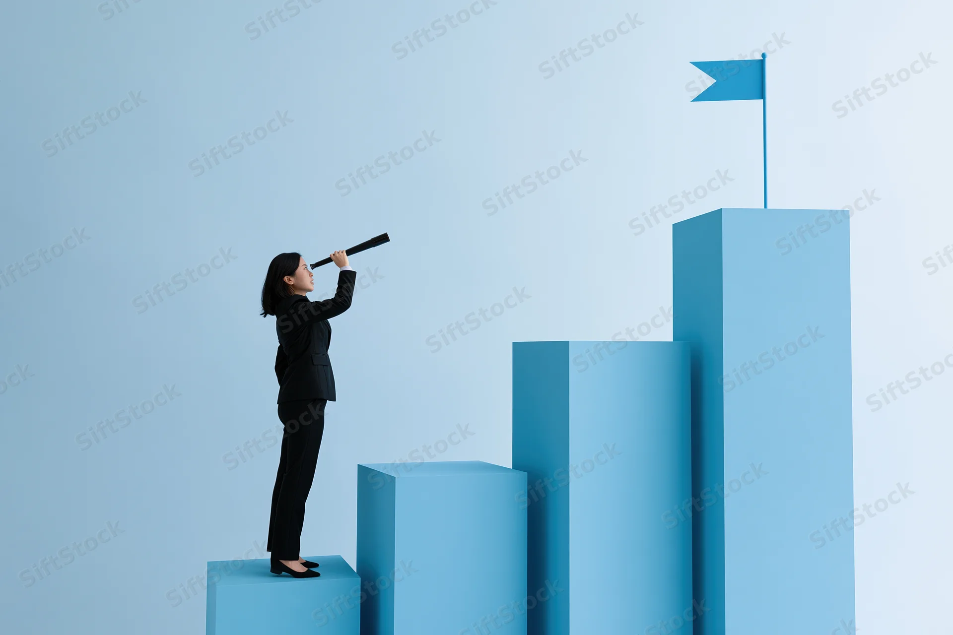Businesswoman in black suit standing on blue bar chart step looking through telescope toward flag at top
