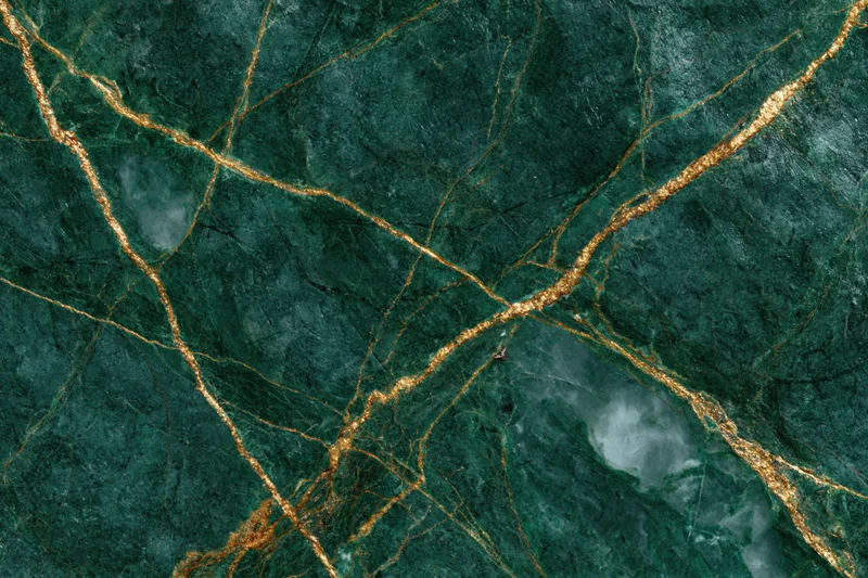 Close-up of deep emerald green marble slab with gold veining