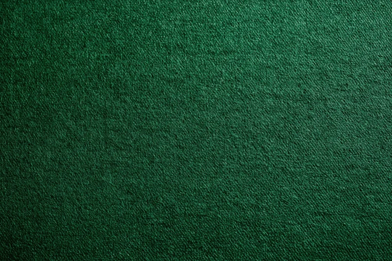 Close-up of deep green textured fabric surface