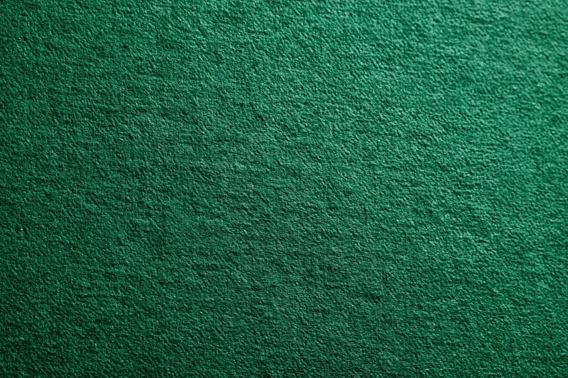 Close-up of deep green textured fabric surface