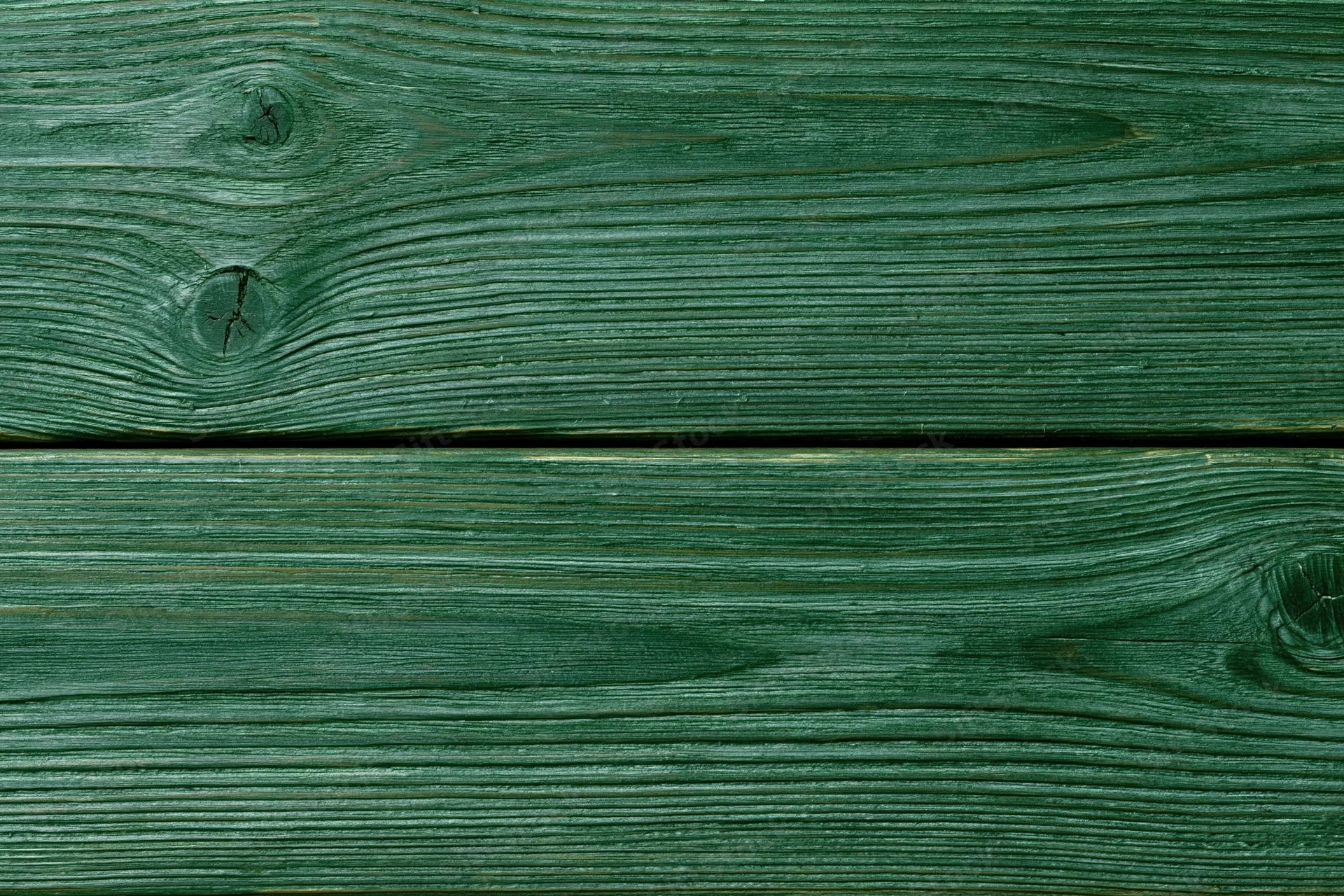 Close-up of green-stained wood planks showing natural grain and knots in horizontal arrangement