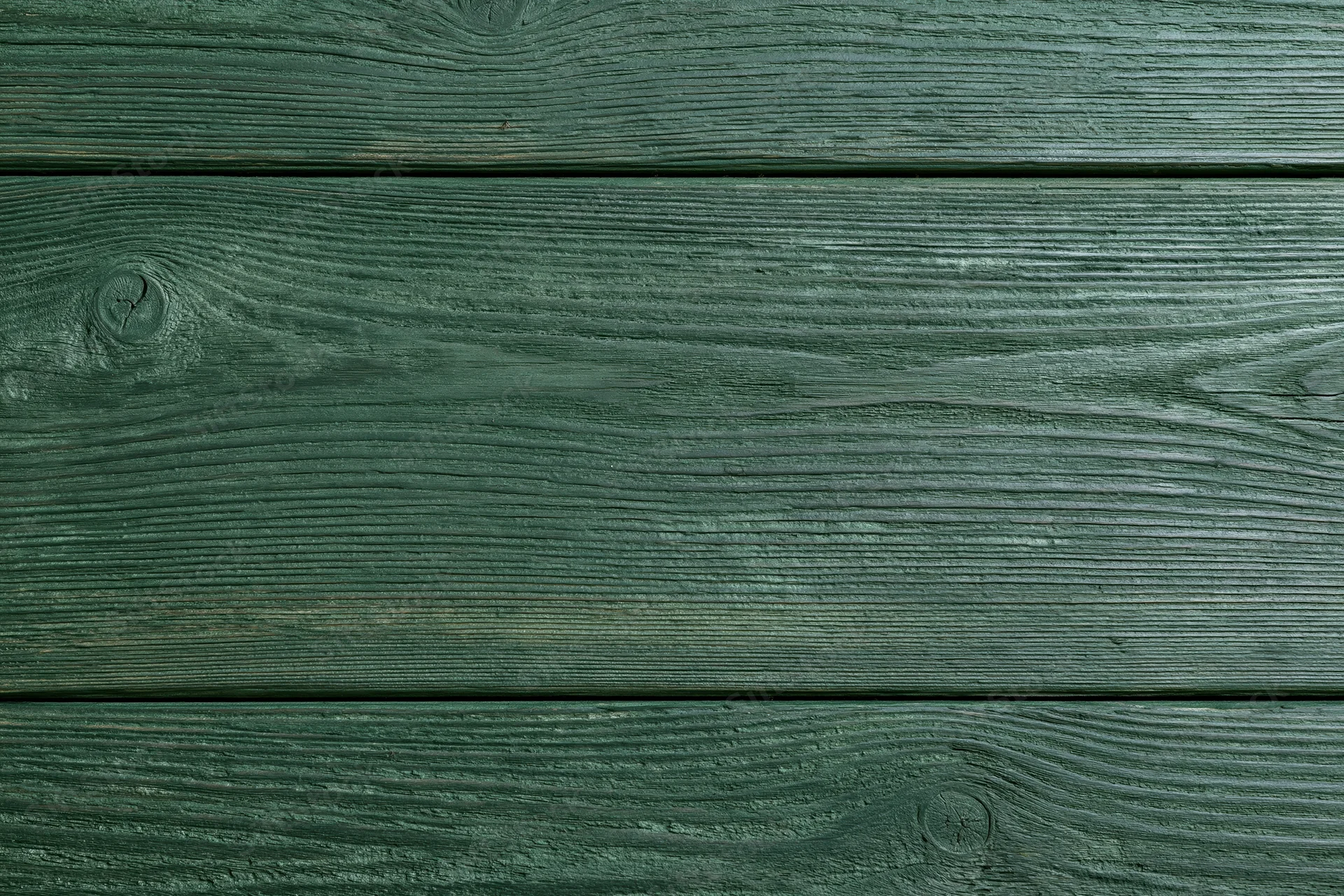 Close-up of green-stained wooden planks arranged horizontally as a textured surface