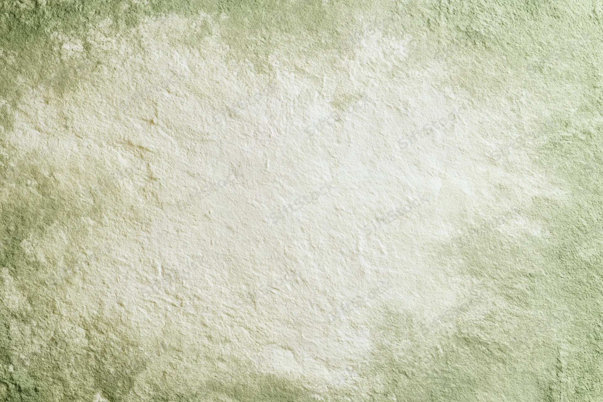 Close-up of aged plaster wall surface with distressed texture and muted green beige tones