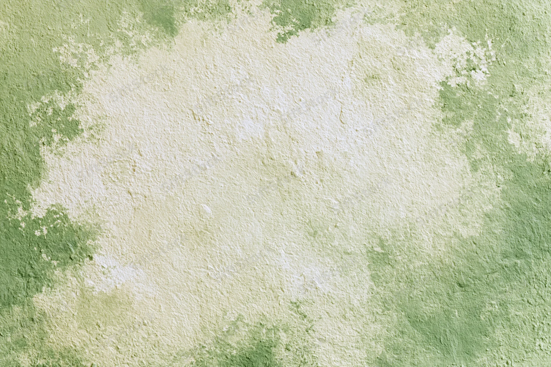 Close-up of aged plaster wall with green and beige weathered texture