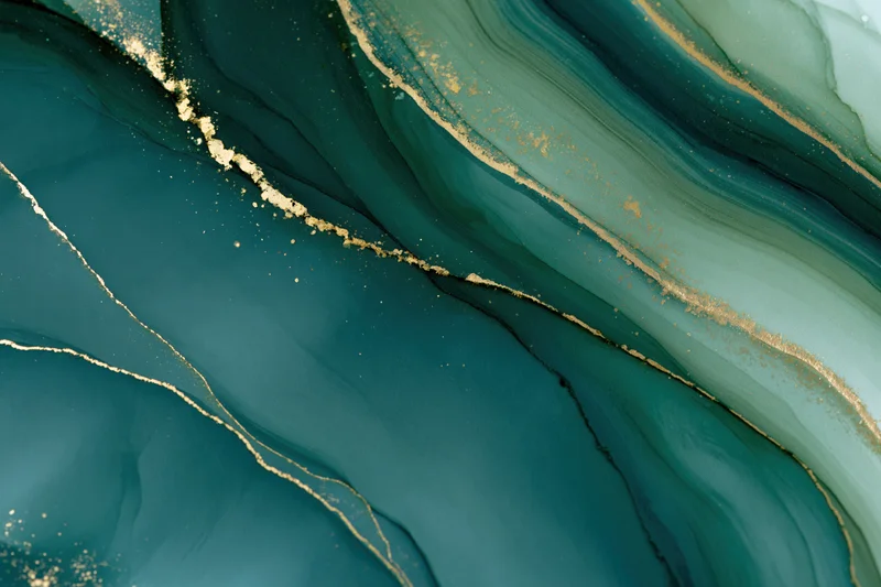 Abstract fluid art with teal and gold ink swirls on paper
