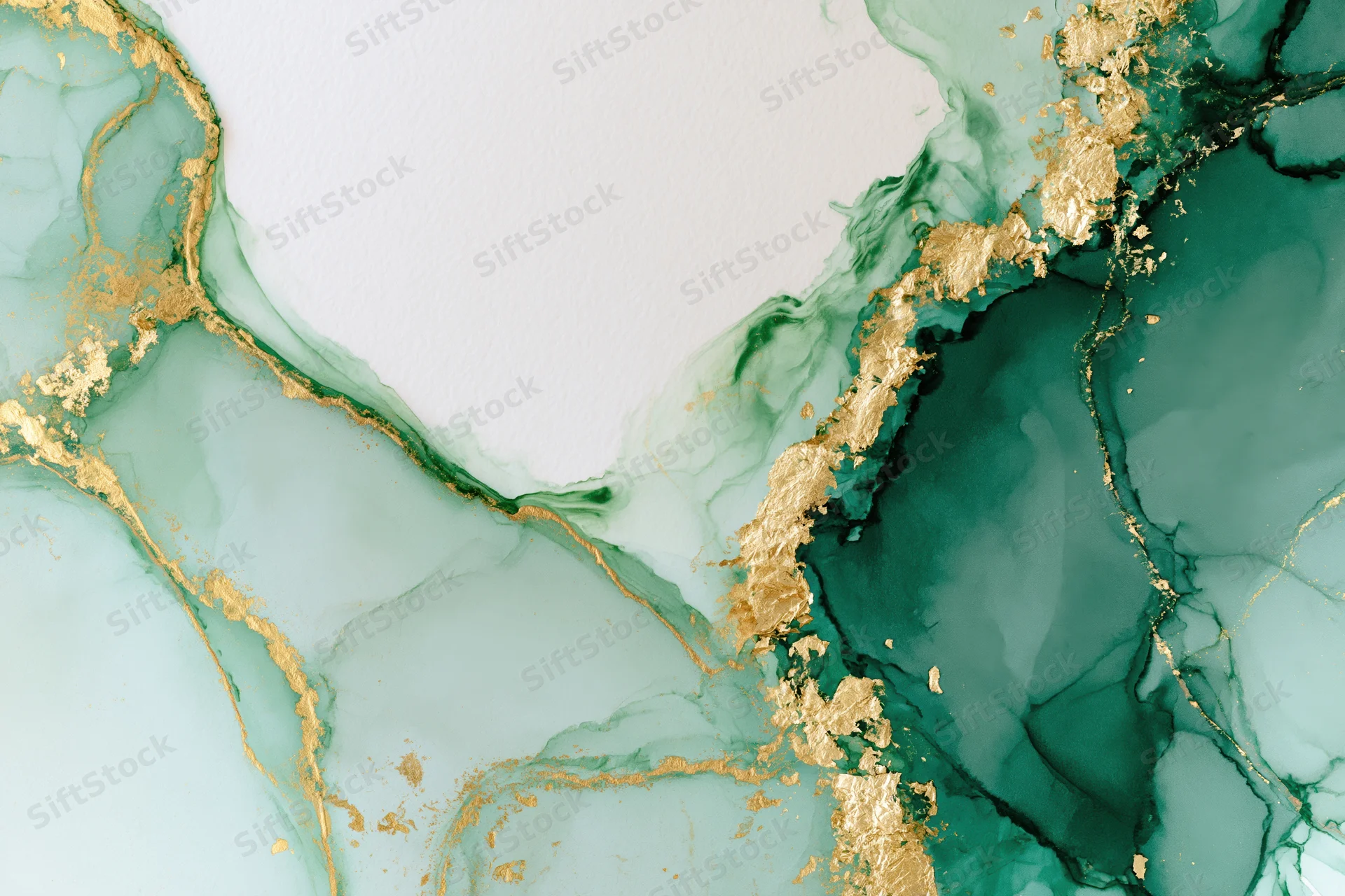 Abstract alcohol ink painting with green and gold swirls on white paper