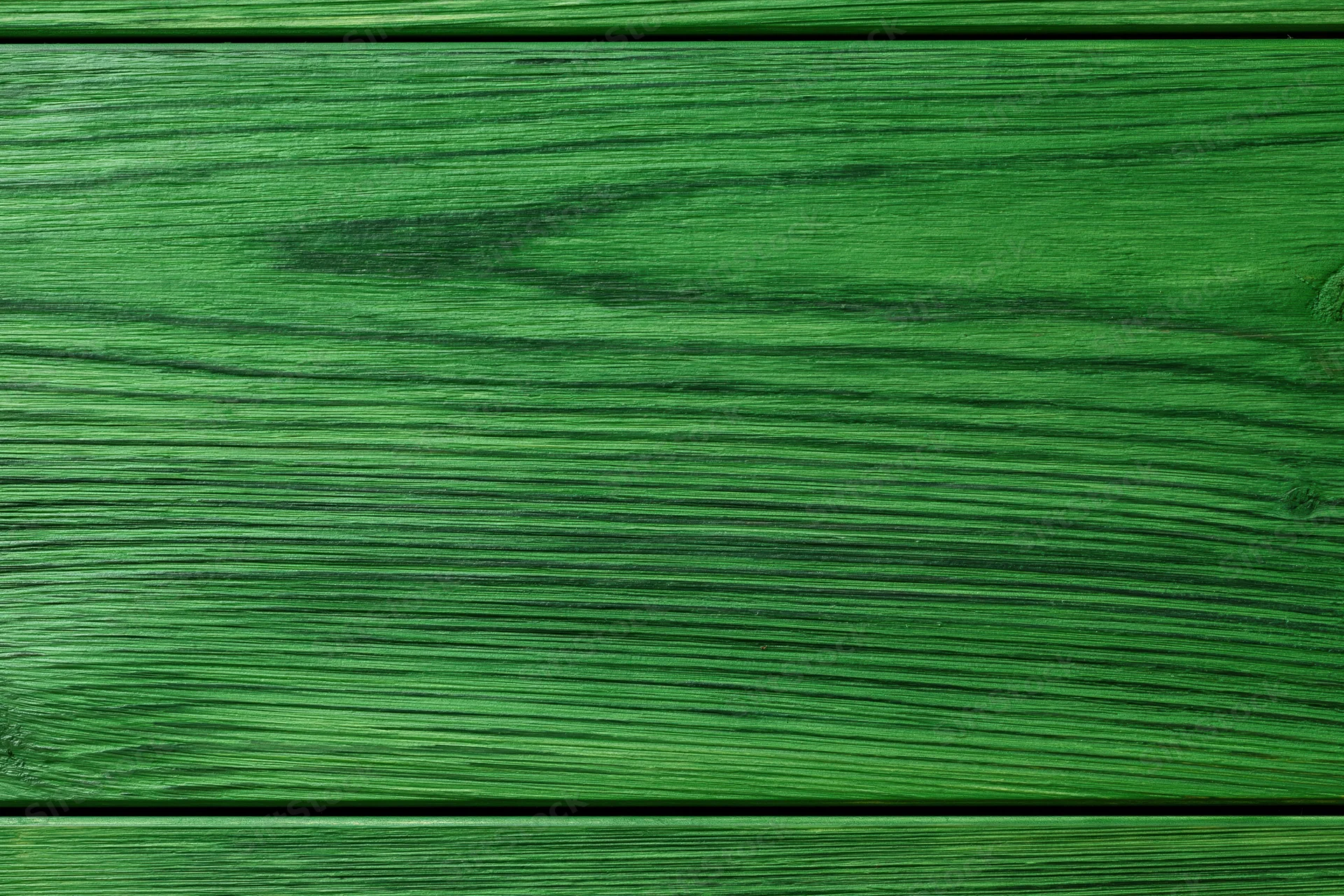 Close-up of green-painted wooden surface with horizontal planks and visible grain