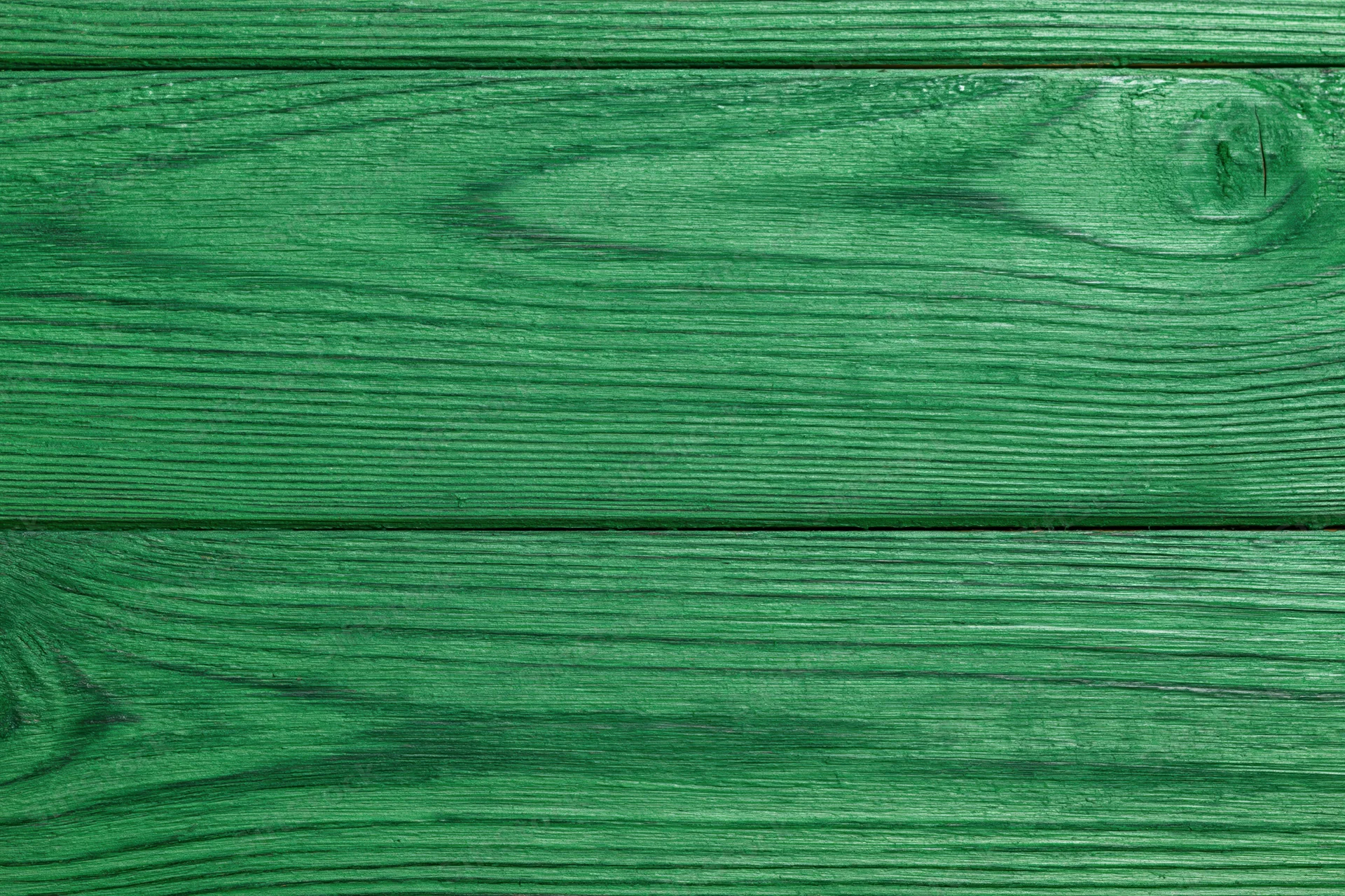Close-up of green-painted wooden planks arranged horizontally as a flat surface