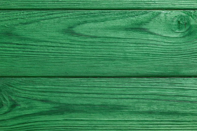 Close-up of green-painted wooden planks arranged horizontally as a flat surface