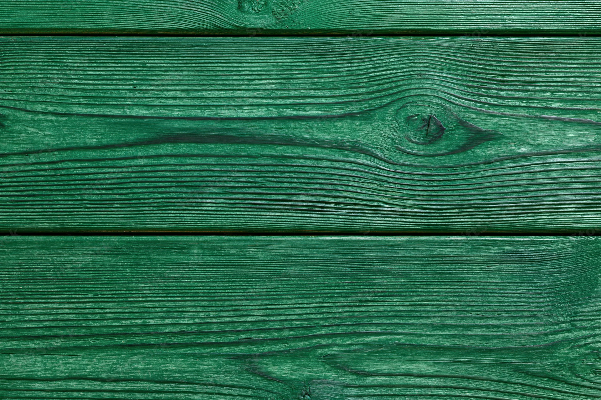Close-up of green-painted wooden planks arranged horizontally as a textured surface
