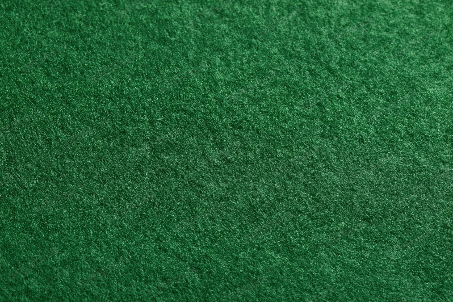 Close-up of green felt fabric surface filling the frame