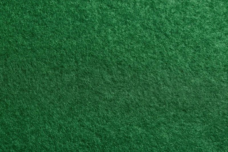 Close-up of green felt fabric surface filling the frame