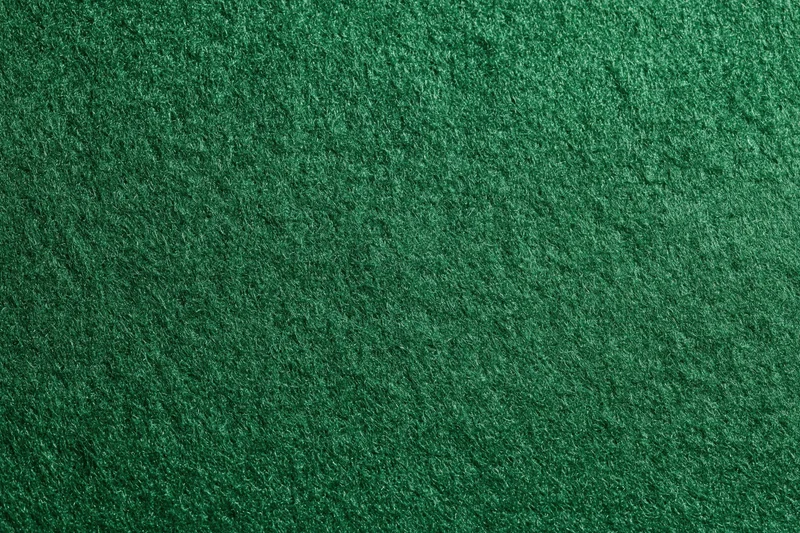 Close-up of green felt fabric surface filling the frame