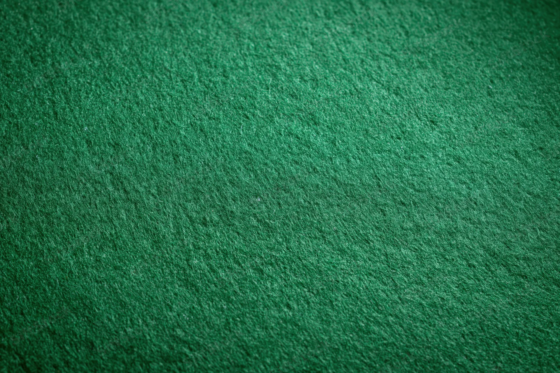 Close-up of green felt fabric surface filling the frame
